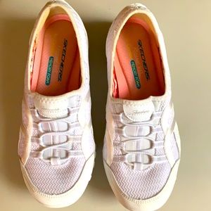 Woman’s Skechers White slip on sneakers
